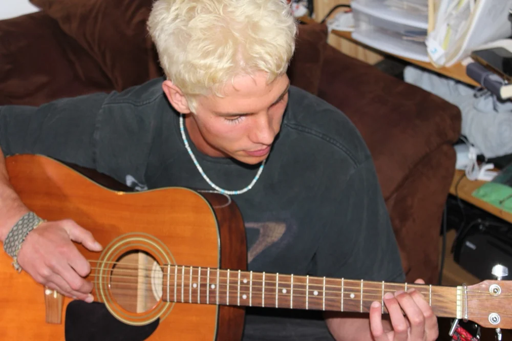 Me, playing guitar at home